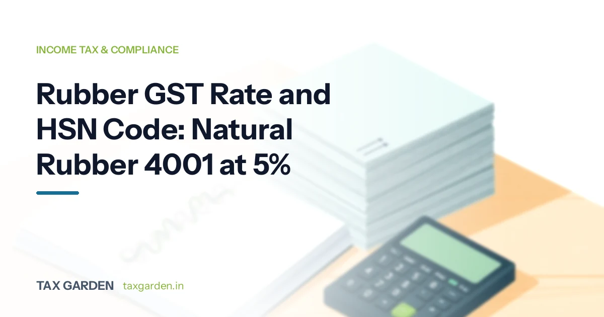 Headline on the rubber GST rate and HSN code at 5 percent beside a stack of pale sheets, a ledger and a calculator on a desk