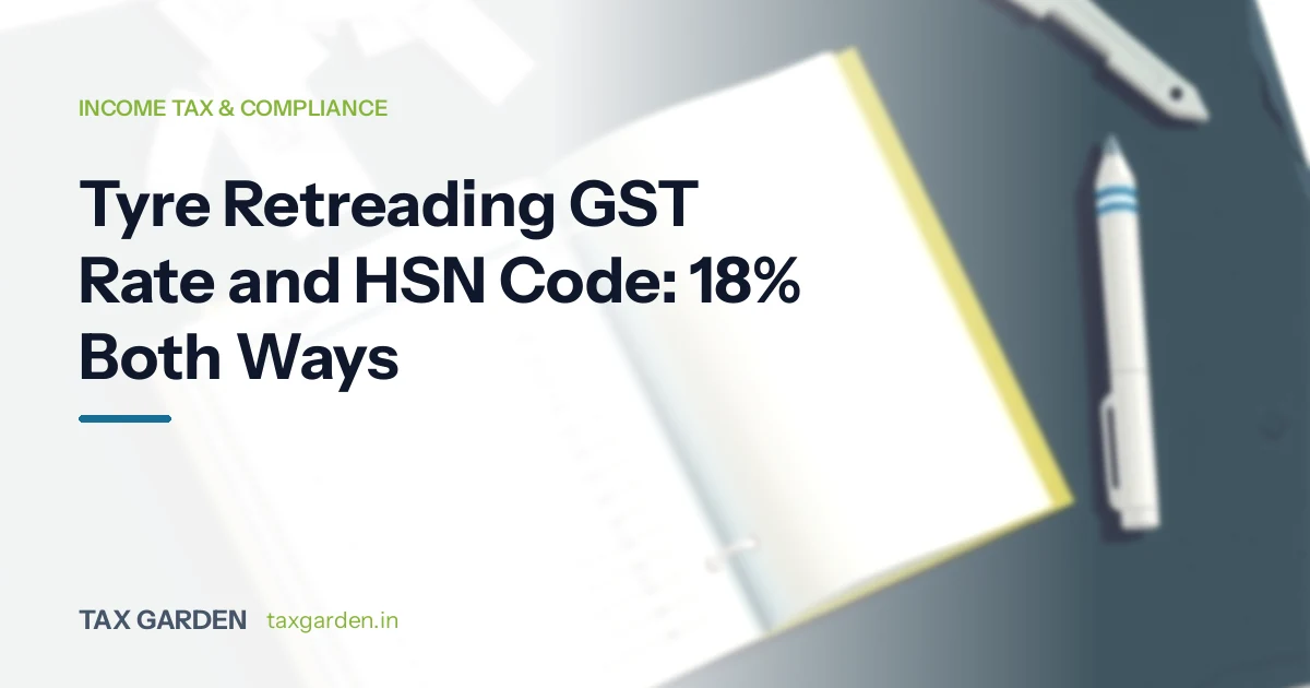 Headline on tyre retreading GST rate and HSN code at 18% beside an open notebook and two pens on a dark desk
